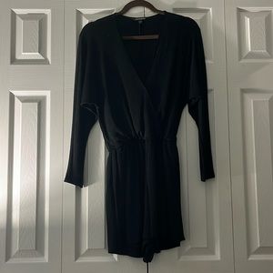 Express Long sleeve black romper with sparkles